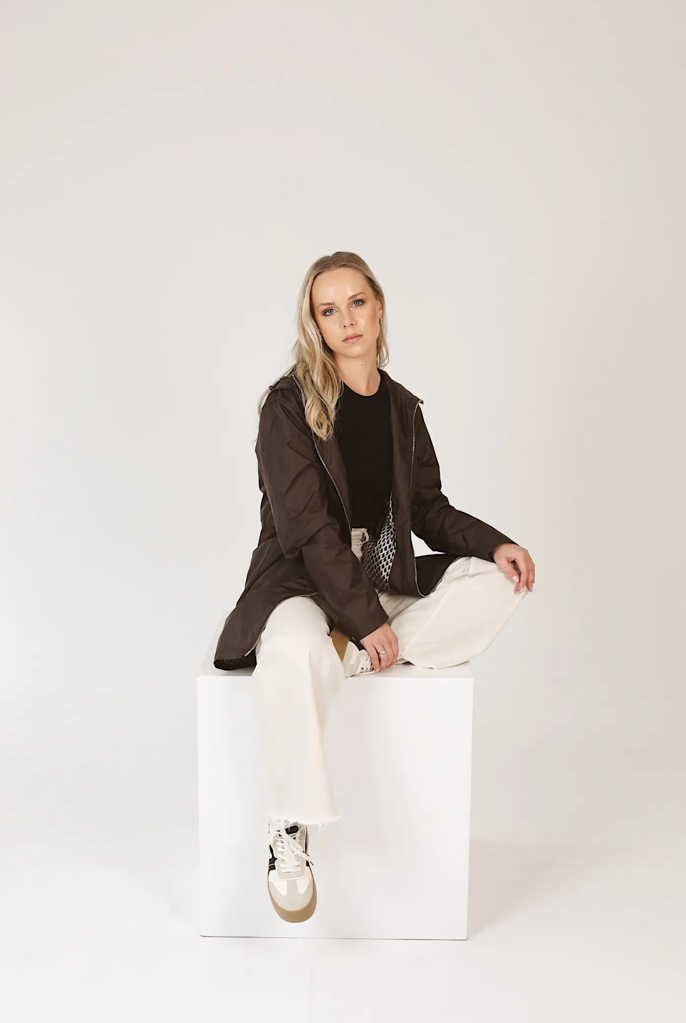 Truffle Haze raincoat in dark brown, lightweight hooded waterproof raincoat ideal for South Africa’s rainy season and wet climate