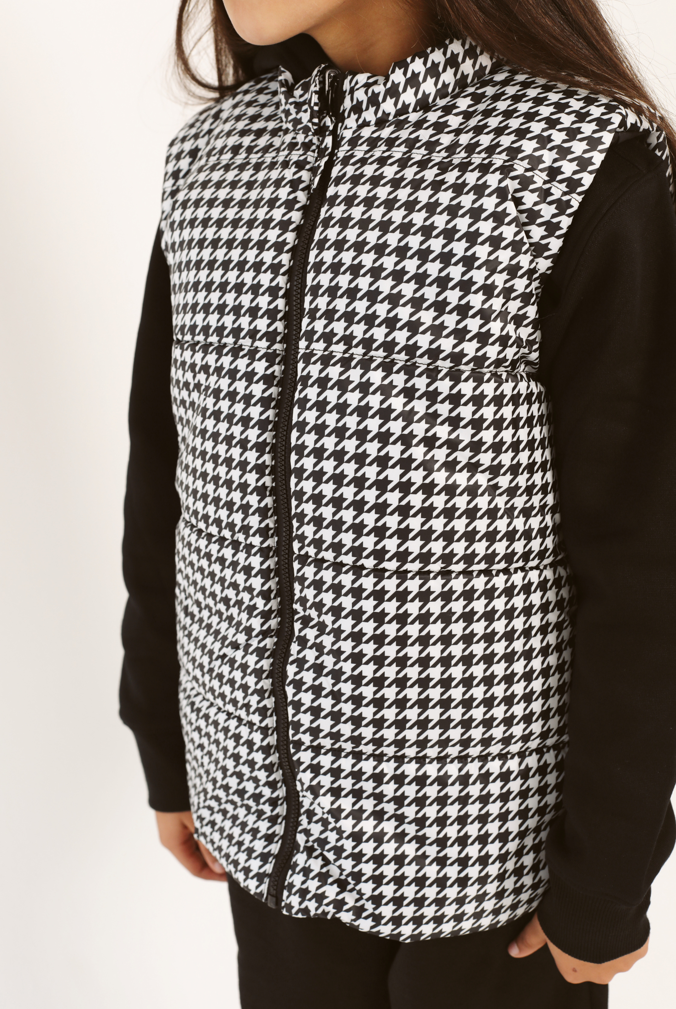 Kids Houndstooth x Black Gilet™ — sleeveless black puffer vest with bold houndstooth print, a versatile winter layer for kids in South Africa
