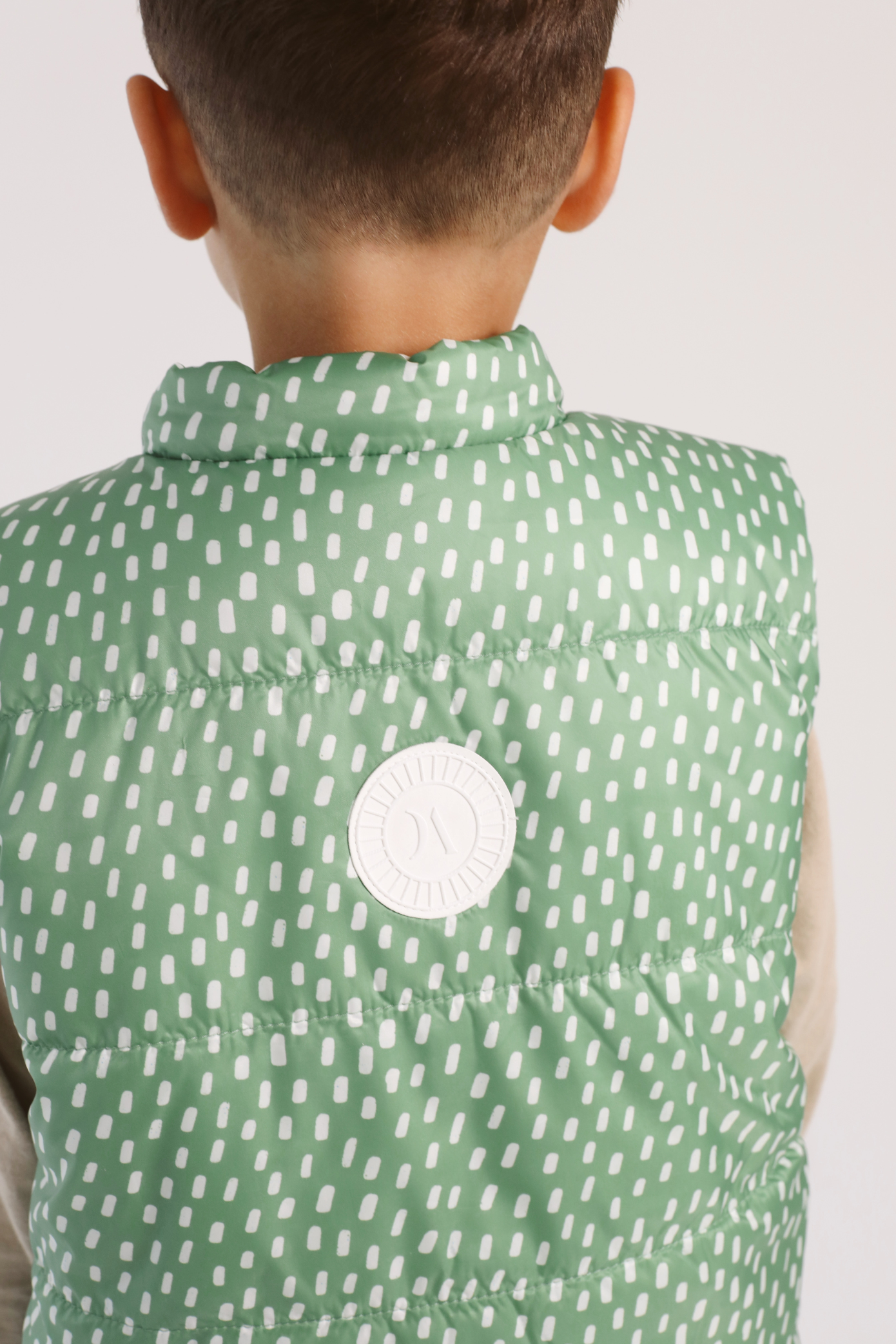 Kids Dots x Green Gilet™ — lightweight sleeveless puffer vest with playful white dot print on green, perfect for layering in South Africa