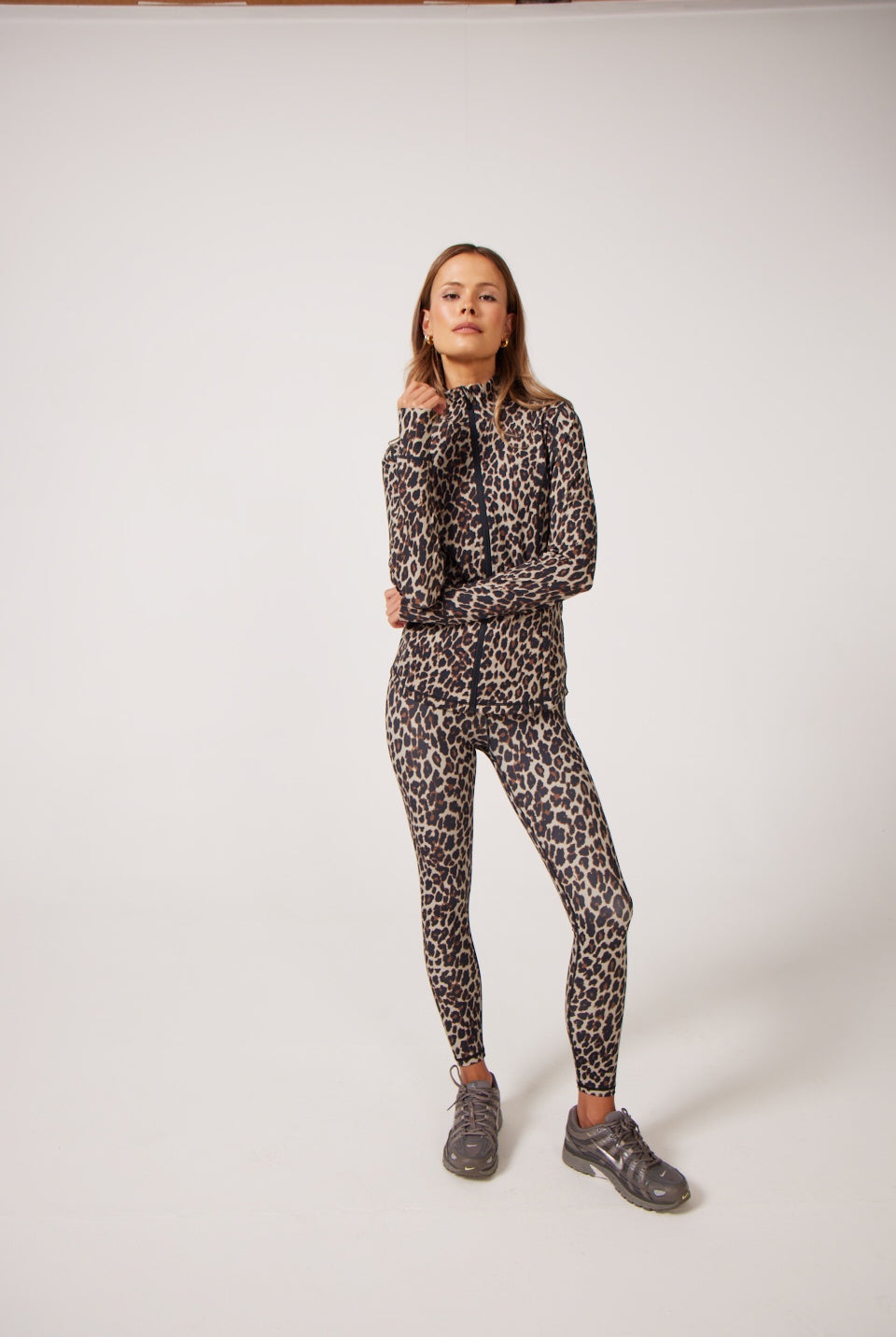 Leopard Lightweight performance jacket with a smooth, sculpting fit, full zip front, high collar, and stretch fabric designed for everyday movement and layering.