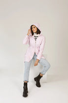 Rosewater Mist raincoat in pastel pink with hood, lightweight waterproof jacket for stylish rainy days in South Africa