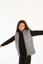 Kids Houndstooth x Black Gilet™ — sleeveless black puffer vest with bold houndstooth print, a versatile winter layer for kids in South Africa
