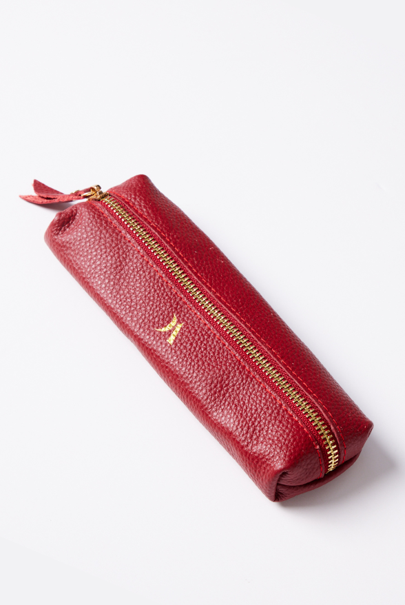 Leather Vanity Bags — assorted colors including orange, pink, red, tan, and black, each with gold zipper detail