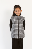 Kids Houndstooth x Black Gilet™ — sleeveless black puffer vest with bold houndstooth print, a versatile winter layer for kids in South Africa