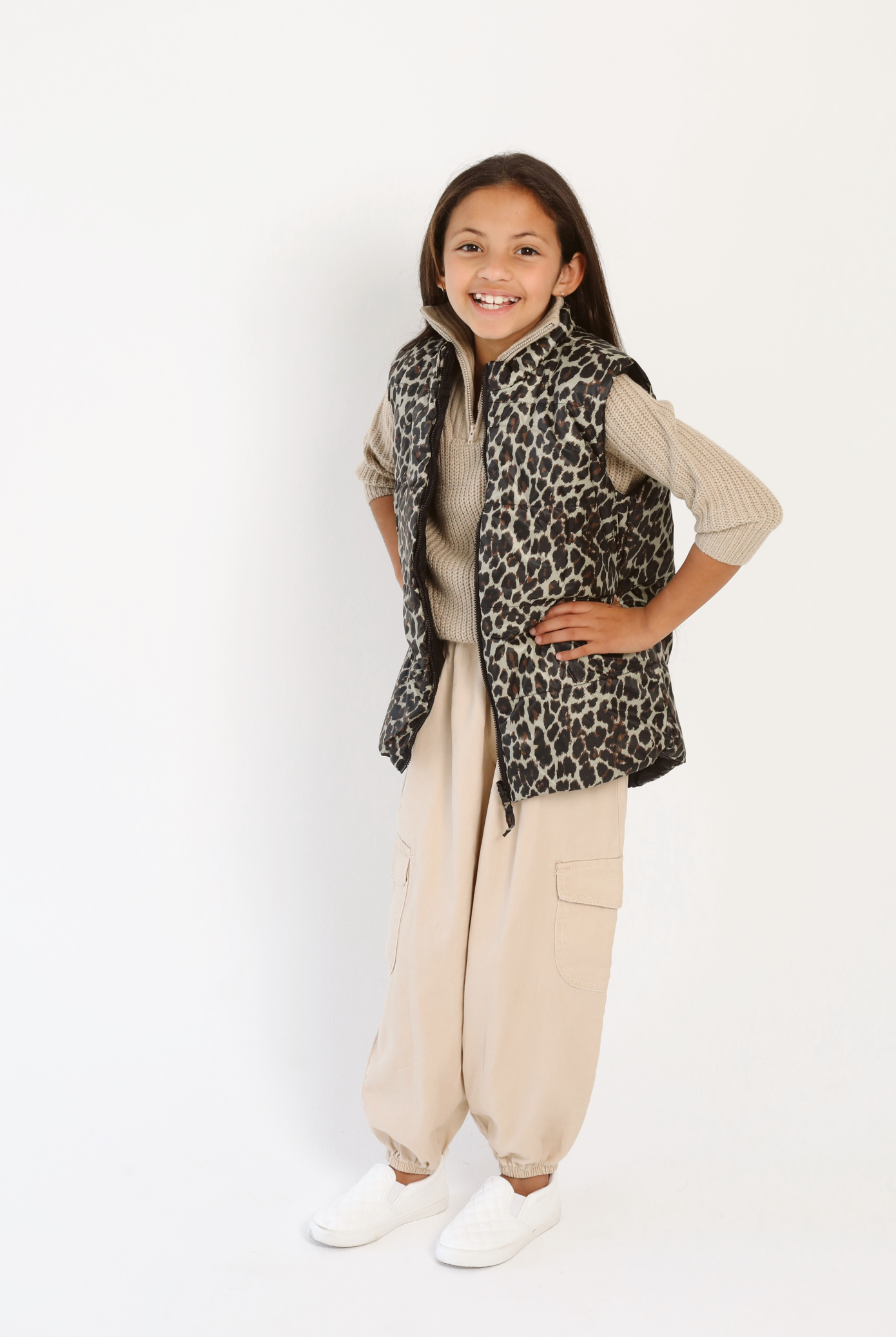 Kids Leopard x Black Gilet™ — sleeveless kids’ puffer vest in bold leopard print with black accents, a fun winter essential in South Africa