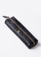 Leather Vanity Bags — assorted colors including orange, pink, red, tan, and black, each with gold zipper detail