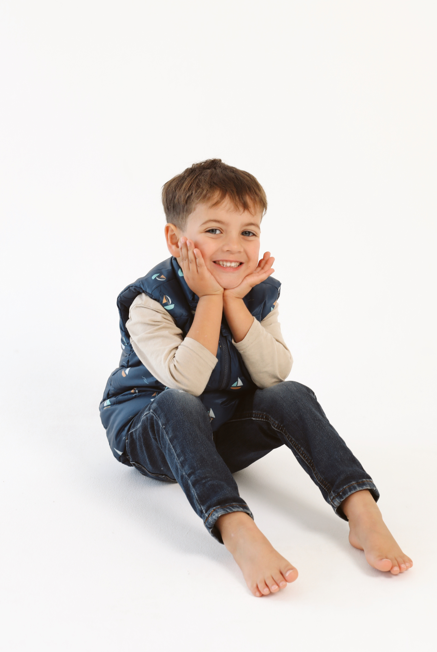 Kids Boats x Navy Gilet™ — sleeveless navy puffer vest with playful boat print, a versatile layer for kids in South Africa