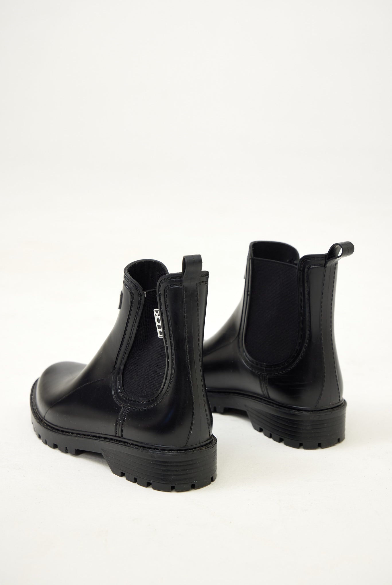 Black Ankle-length gumboots with elastic side panels and durable sole, designed for everyday outdoor and wet-weather use