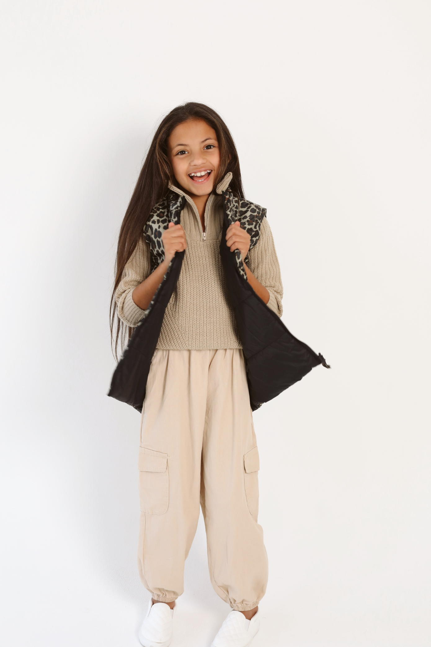 Kids Leopard x Black Gilet™ — sleeveless kids’ puffer vest in bold leopard print with black accents, a fun winter essential in South Africa