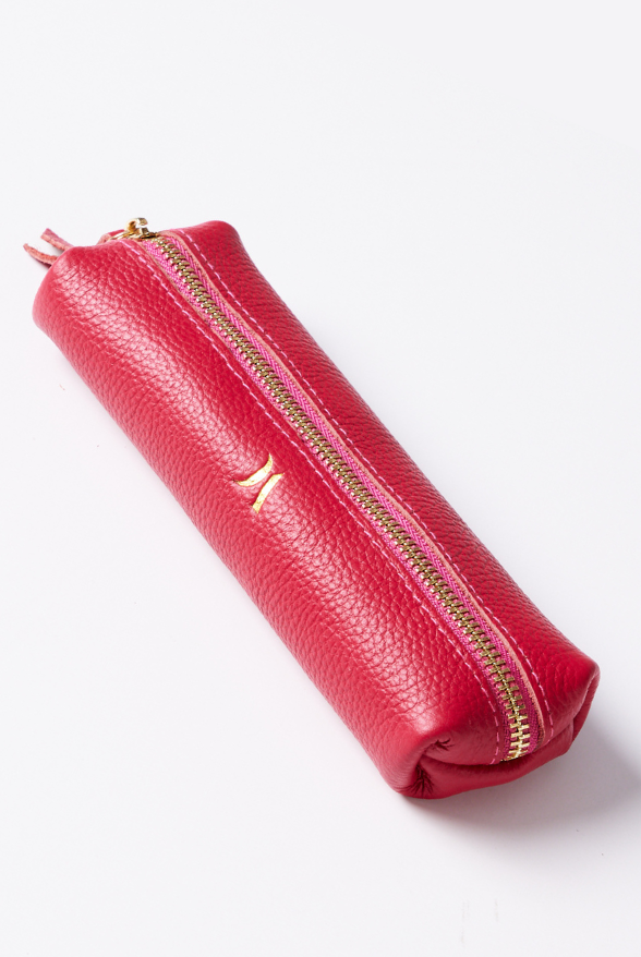 Leather Vanity Bags — assorted colors including orange, pink, red, tan, and black, each with gold zipper detail