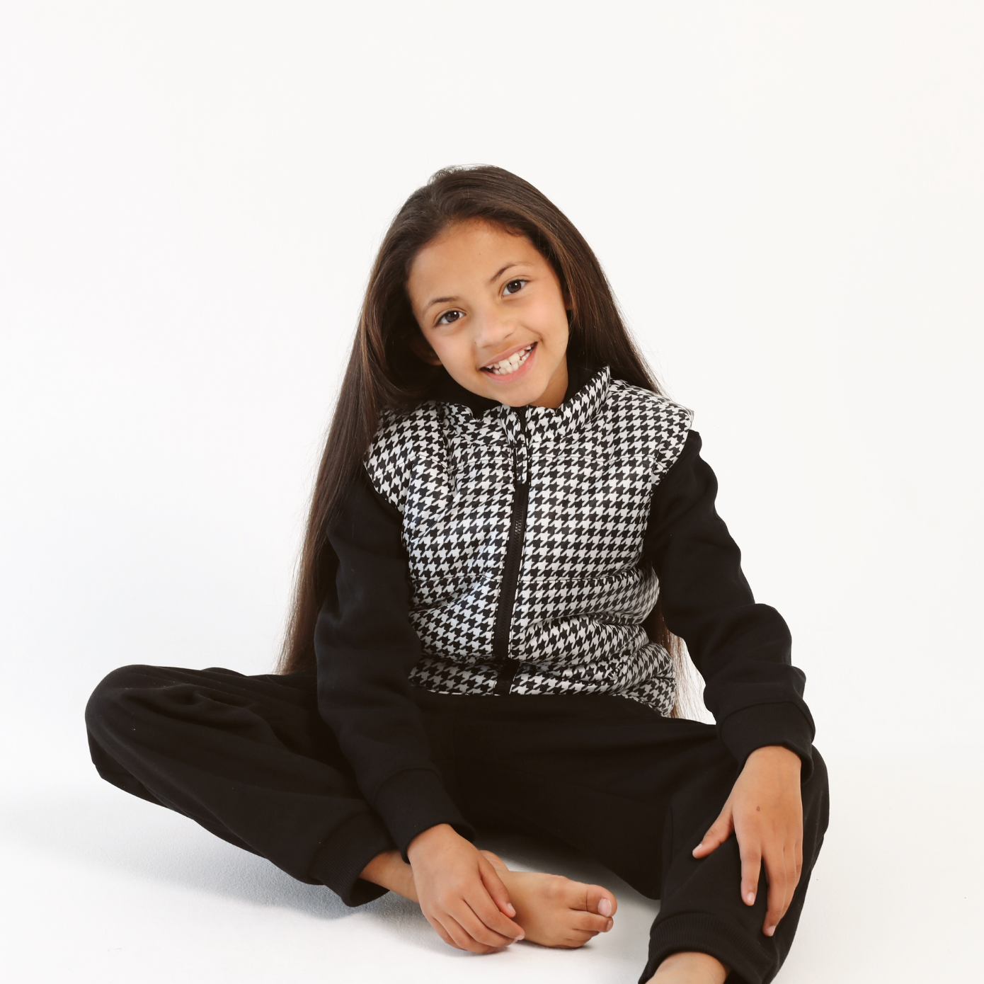 Kids Houndstooth x Black Gilet™ — sleeveless black puffer vest with bold houndstooth print, a versatile winter layer for kids in South Africa