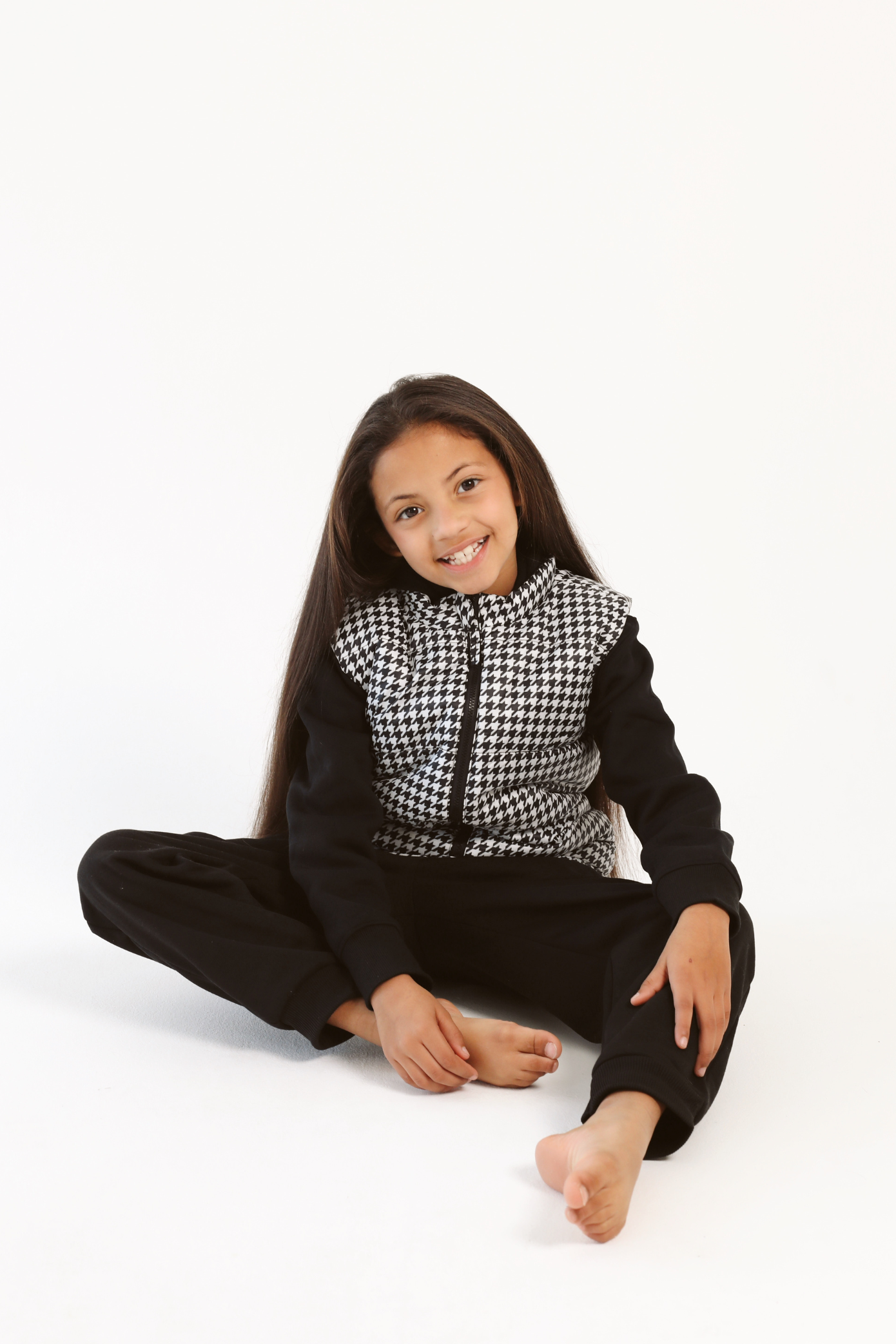 Kids Houndstooth x Black Gilet™ — sleeveless black puffer vest with bold houndstooth print, a versatile winter layer for kids in South Africa