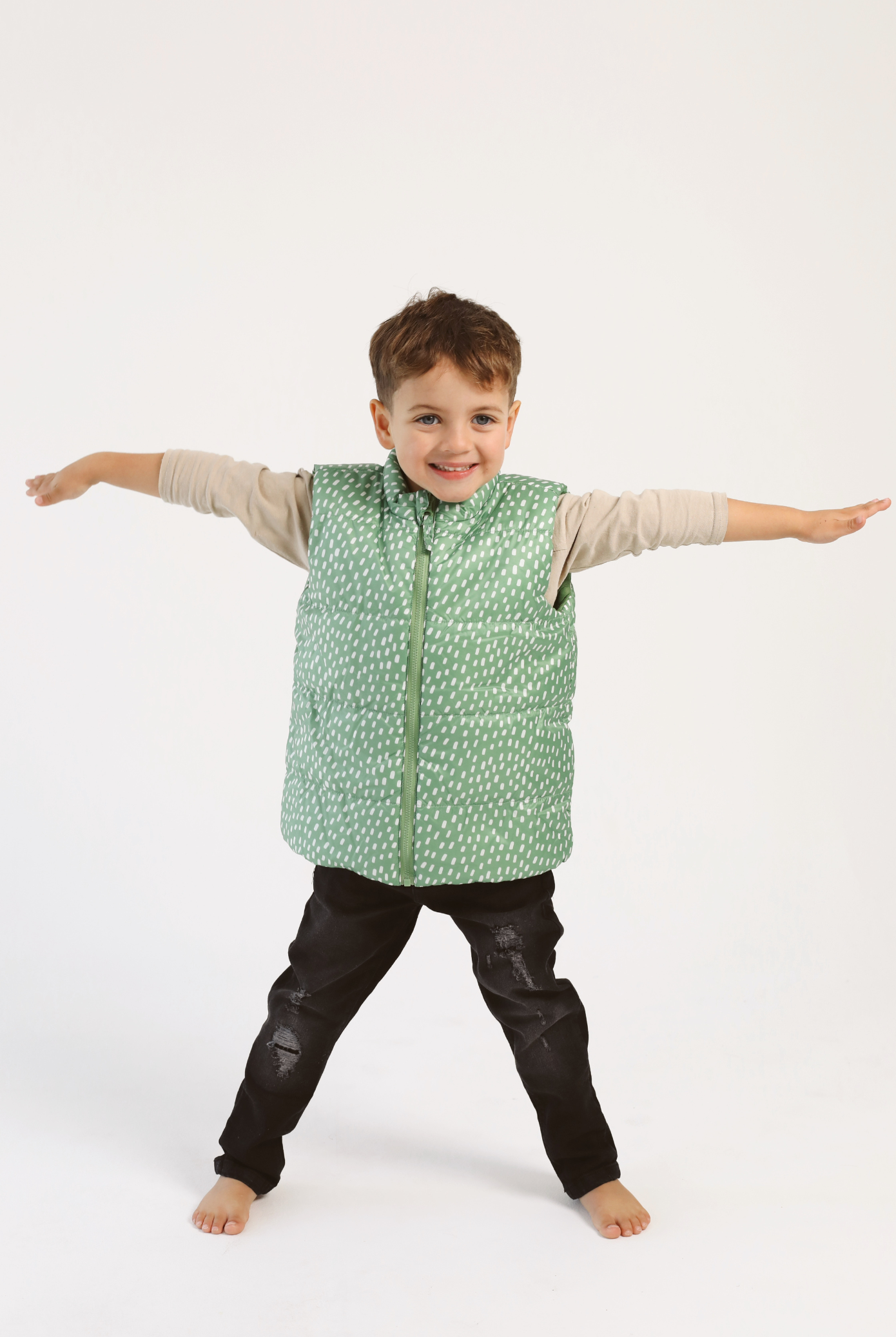 Kids Dots x Green Gilet™ — lightweight sleeveless puffer vest with playful white dot print on green, perfect for layering in South Africa