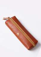 Leather Vanity Bags — assorted colors including orange, pink, red, tan, and black, each with gold zipper detail