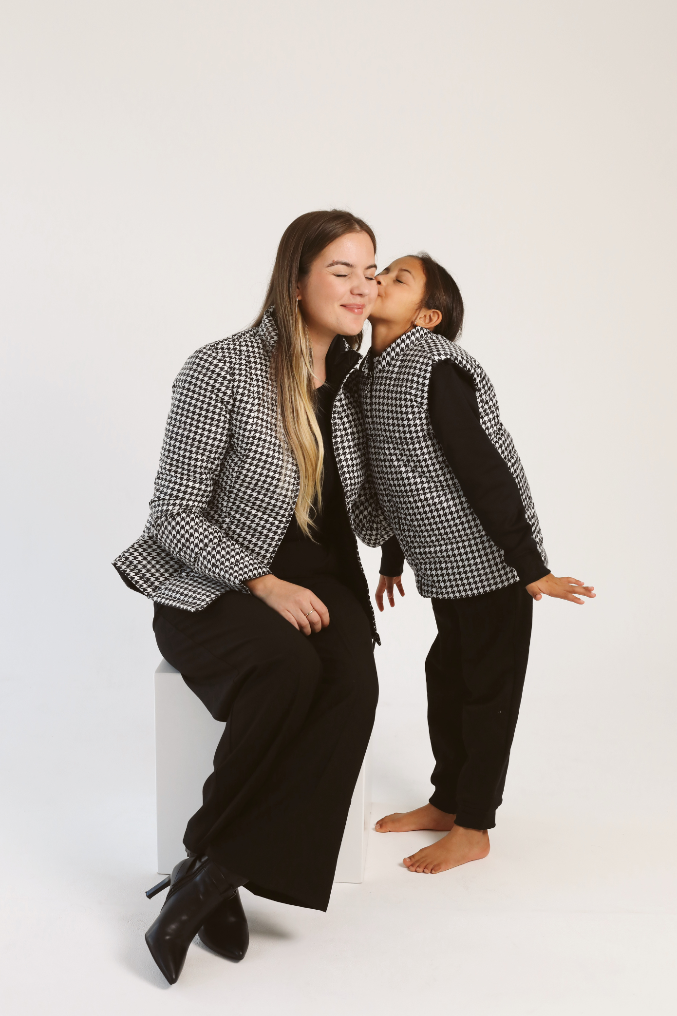 Kids Houndstooth x Black Gilet™ — sleeveless black puffer vest with bold houndstooth print, a versatile winter layer for kids in South Africa