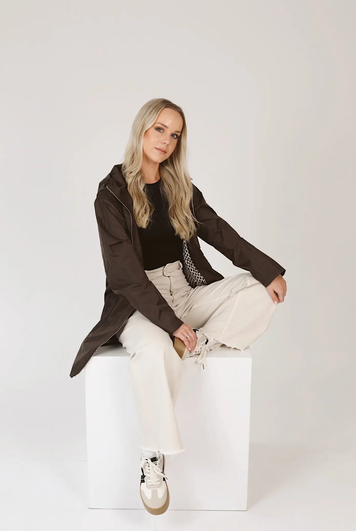 Truffle Haze raincoat in dark brown, lightweight hooded waterproof raincoat ideal for South Africa’s rainy season and wet climate