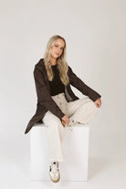 Truffle Haze raincoat in dark brown, lightweight hooded waterproof raincoat ideal for South Africa’s rainy season and wet climate