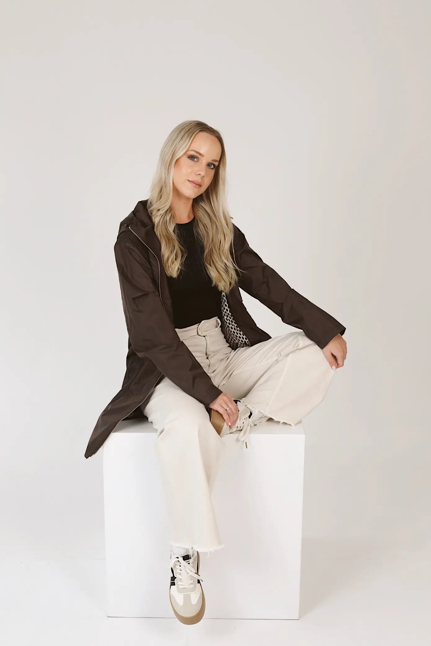 Truffle Haze raincoat in dark brown, lightweight hooded waterproof raincoat ideal for South Africa’s rainy season and wet climate