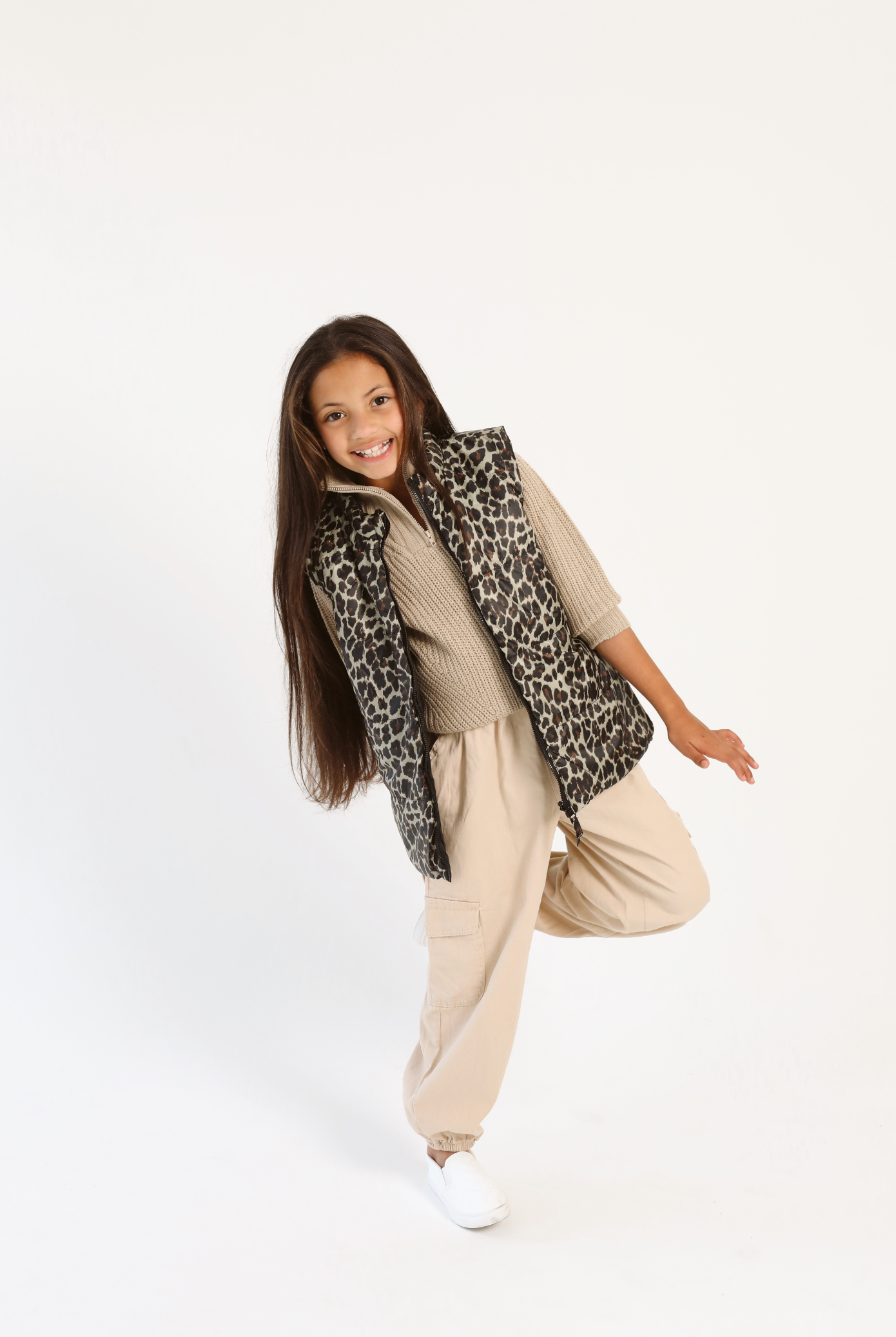 Kids Leopard x Black Gilet™ — sleeveless kids’ puffer vest in bold leopard print with black accents, a fun winter essential in South Africa