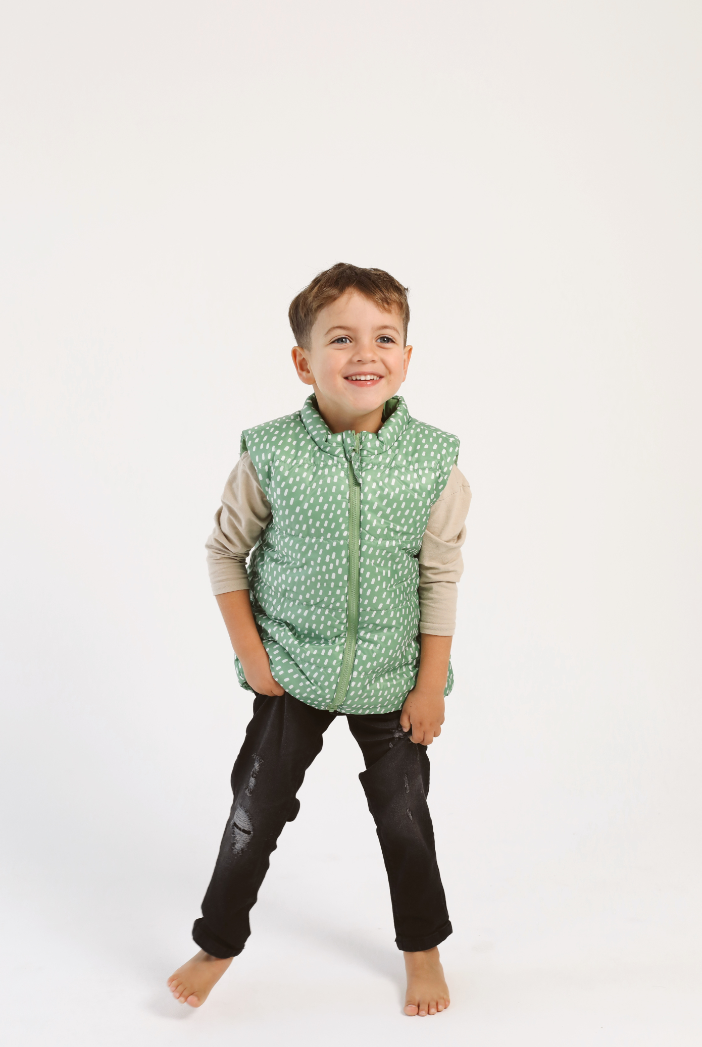 Kids Dots x Green Gilet™ — lightweight sleeveless puffer vest with playful white dot print on green, perfect for layering in South Africa