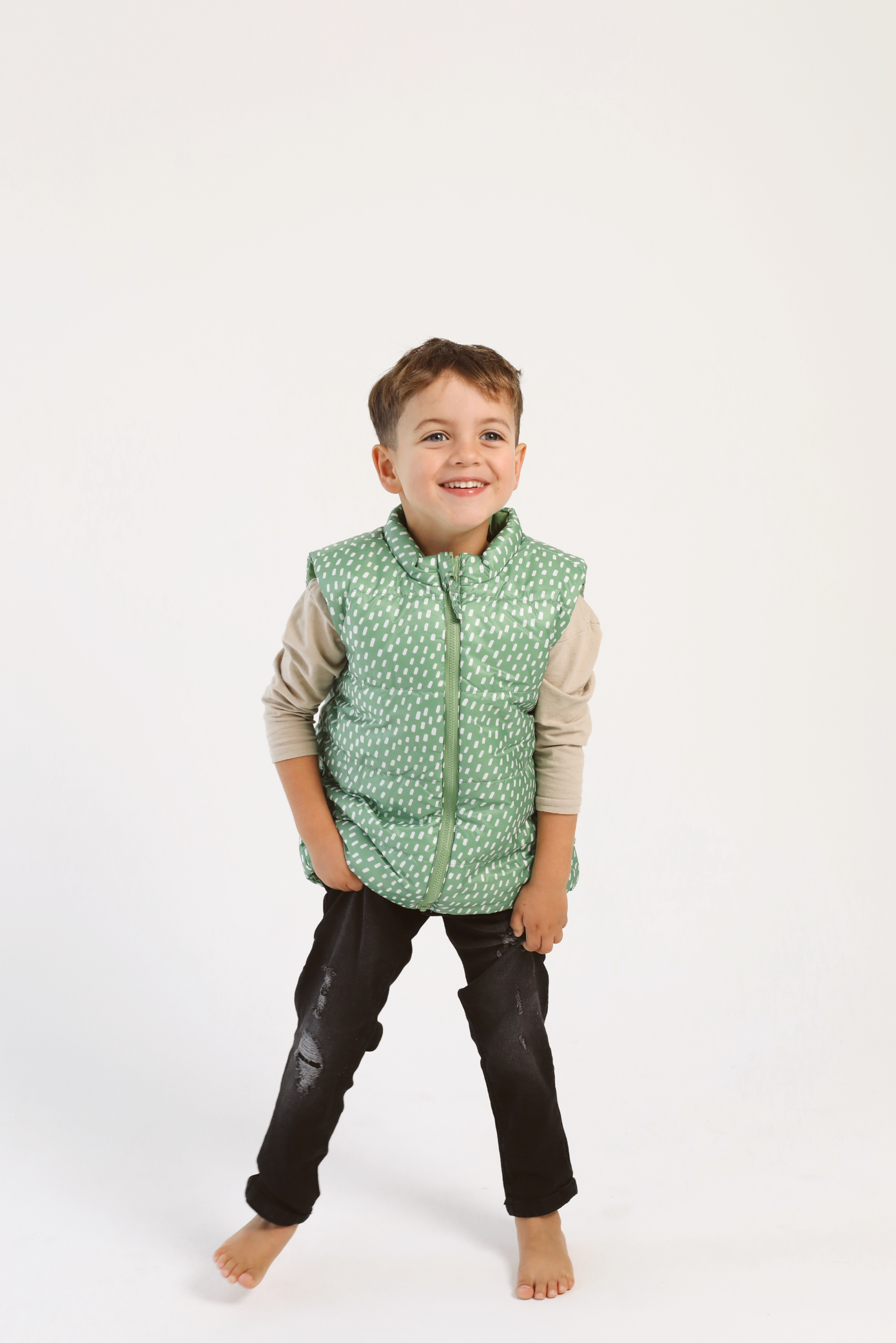 Kids Dots x Green Gilet™ — lightweight sleeveless puffer vest with playful white dot print on green, perfect for layering in South Africa