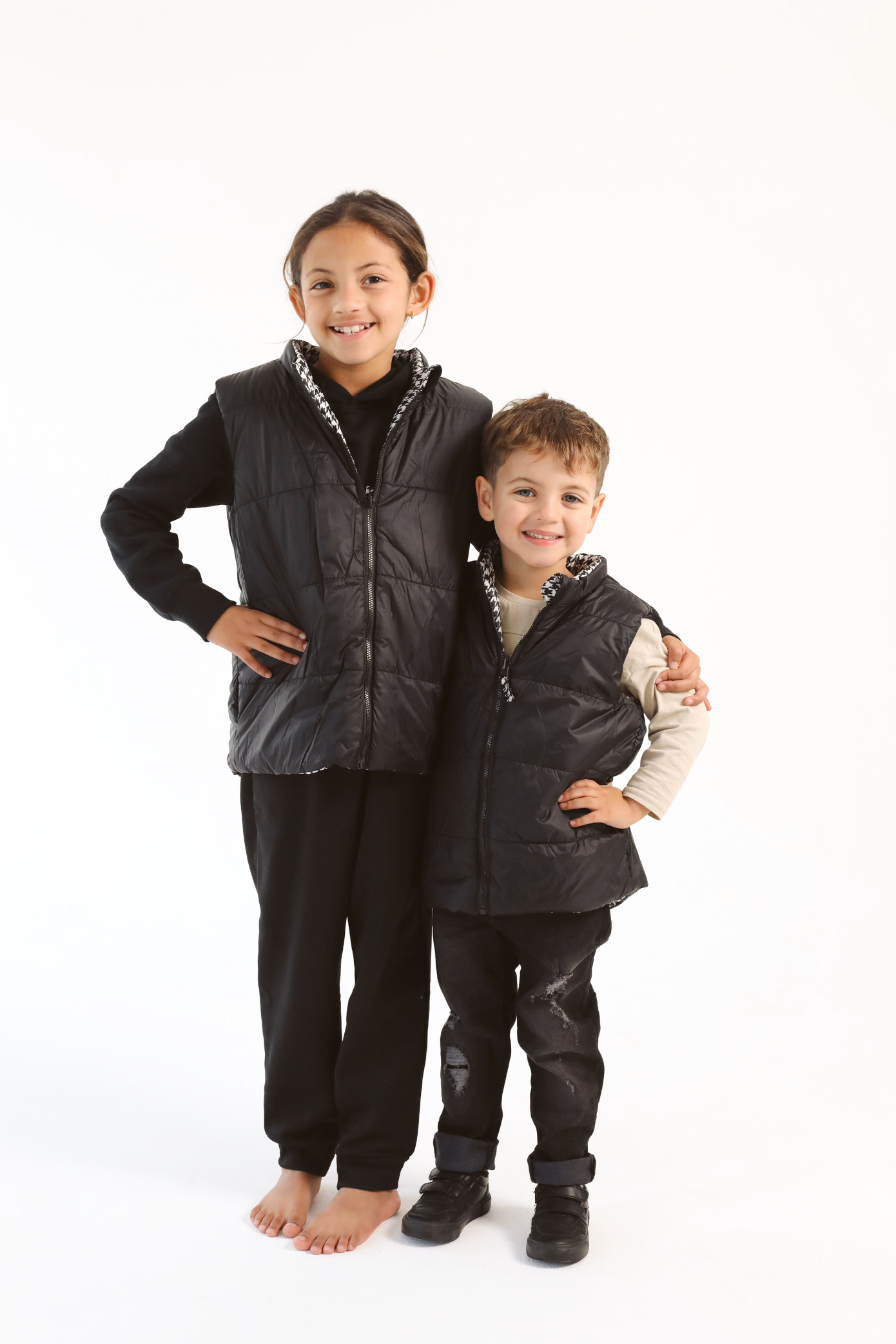 Kids Houndstooth x Black Gilet™ — sleeveless black puffer vest with bold houndstooth print, a versatile winter layer for kids in South Africa