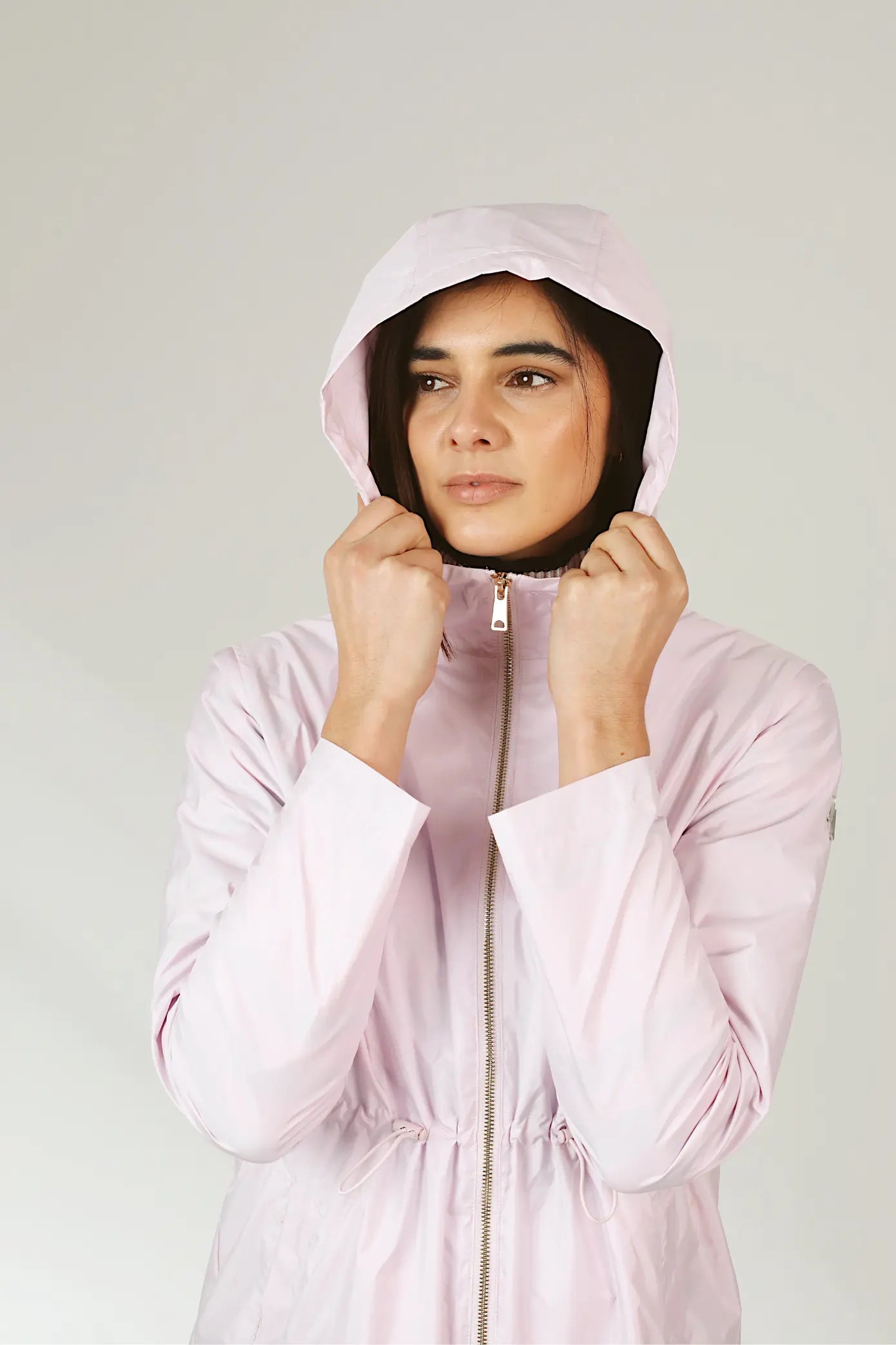 Rosewater Mist raincoat in pastel pink with hood, lightweight waterproof jacket for stylish rainy days in South Africa