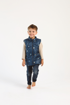 Kids Boats x Navy Gilet™ — sleeveless navy puffer vest with playful boat print, a versatile layer for kids in South Africa