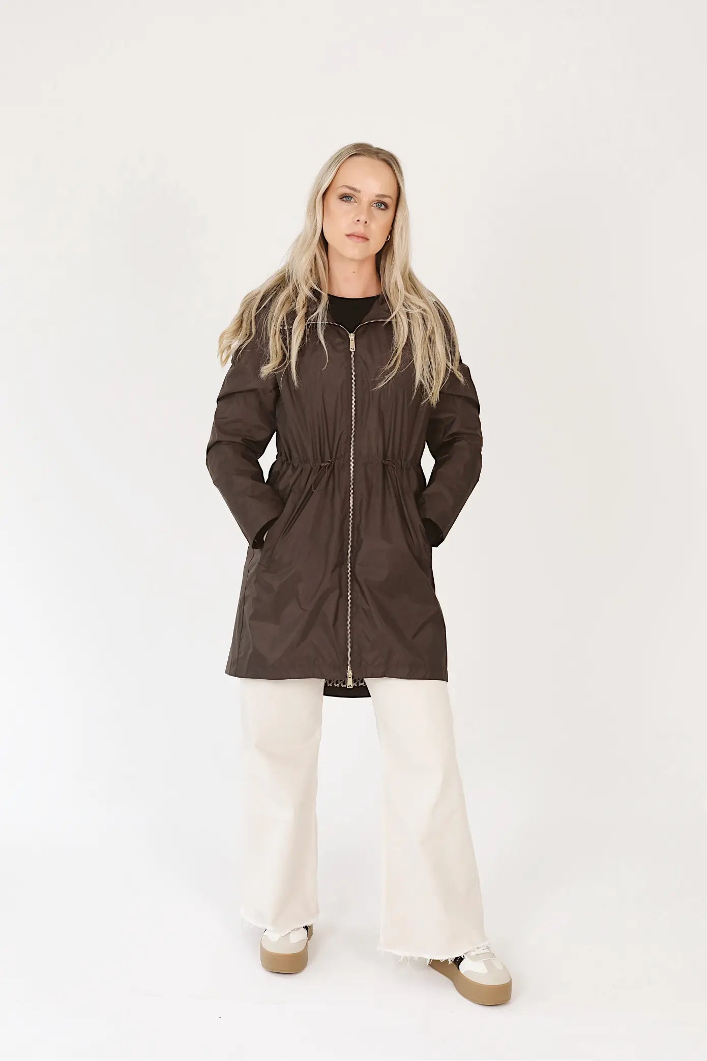 Truffle Haze raincoat in dark brown, lightweight hooded waterproof raincoat ideal for South Africa’s rainy season and wet climate