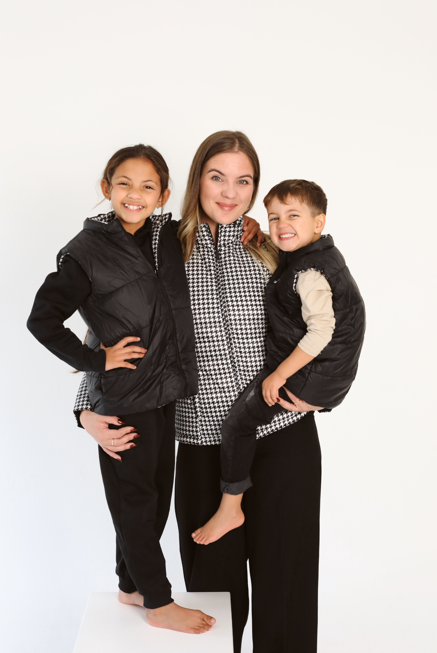 Kids Houndstooth x Black Gilet™ — sleeveless black puffer vest with bold houndstooth print, a versatile winter layer for kids in South Africa