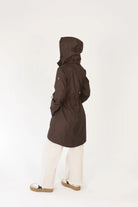 Truffle Haze raincoat in dark brown, lightweight hooded waterproof raincoat ideal for South Africa’s rainy season and wet climate