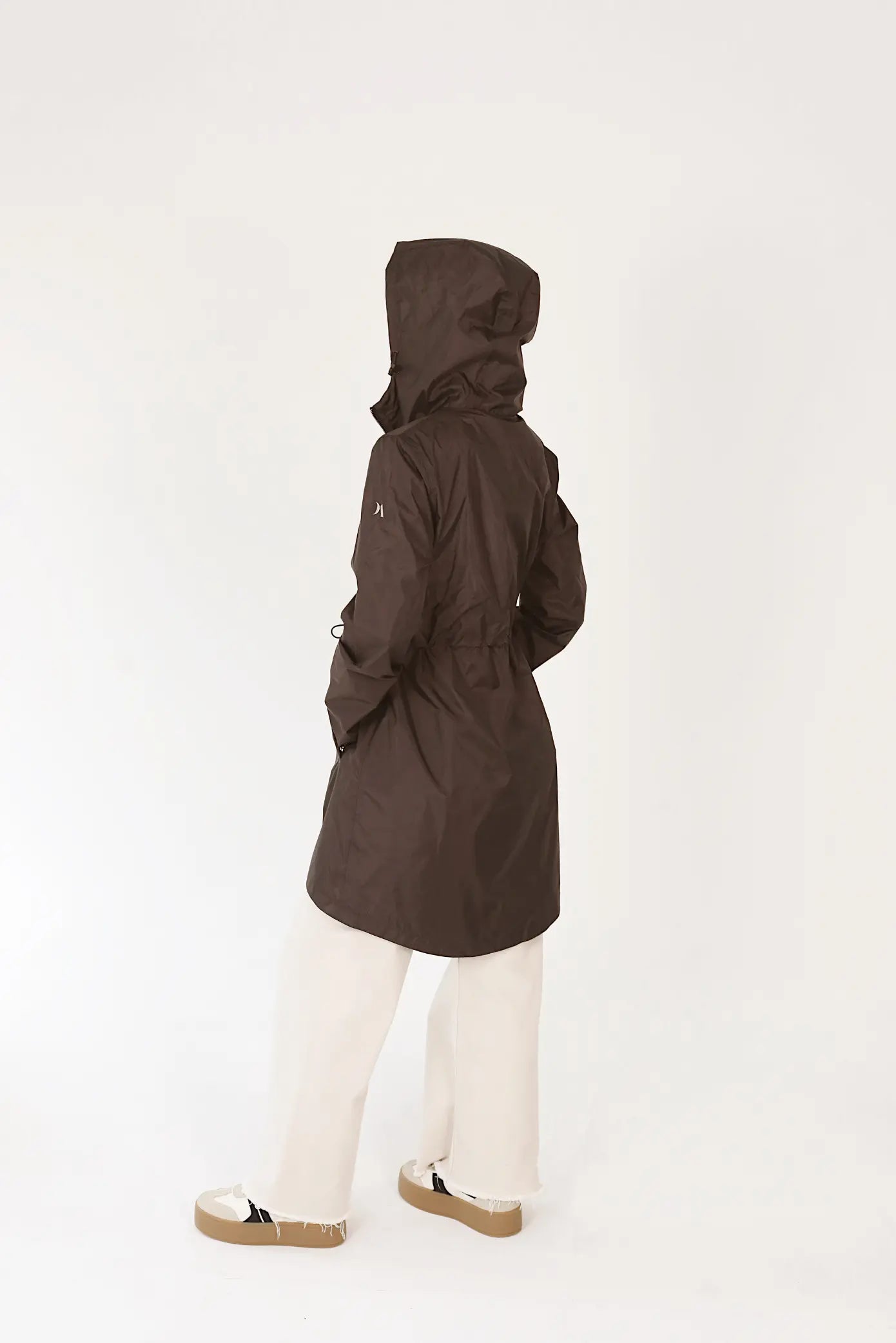 Truffle Haze raincoat in dark brown, lightweight hooded waterproof raincoat ideal for South Africa’s rainy season and wet climate