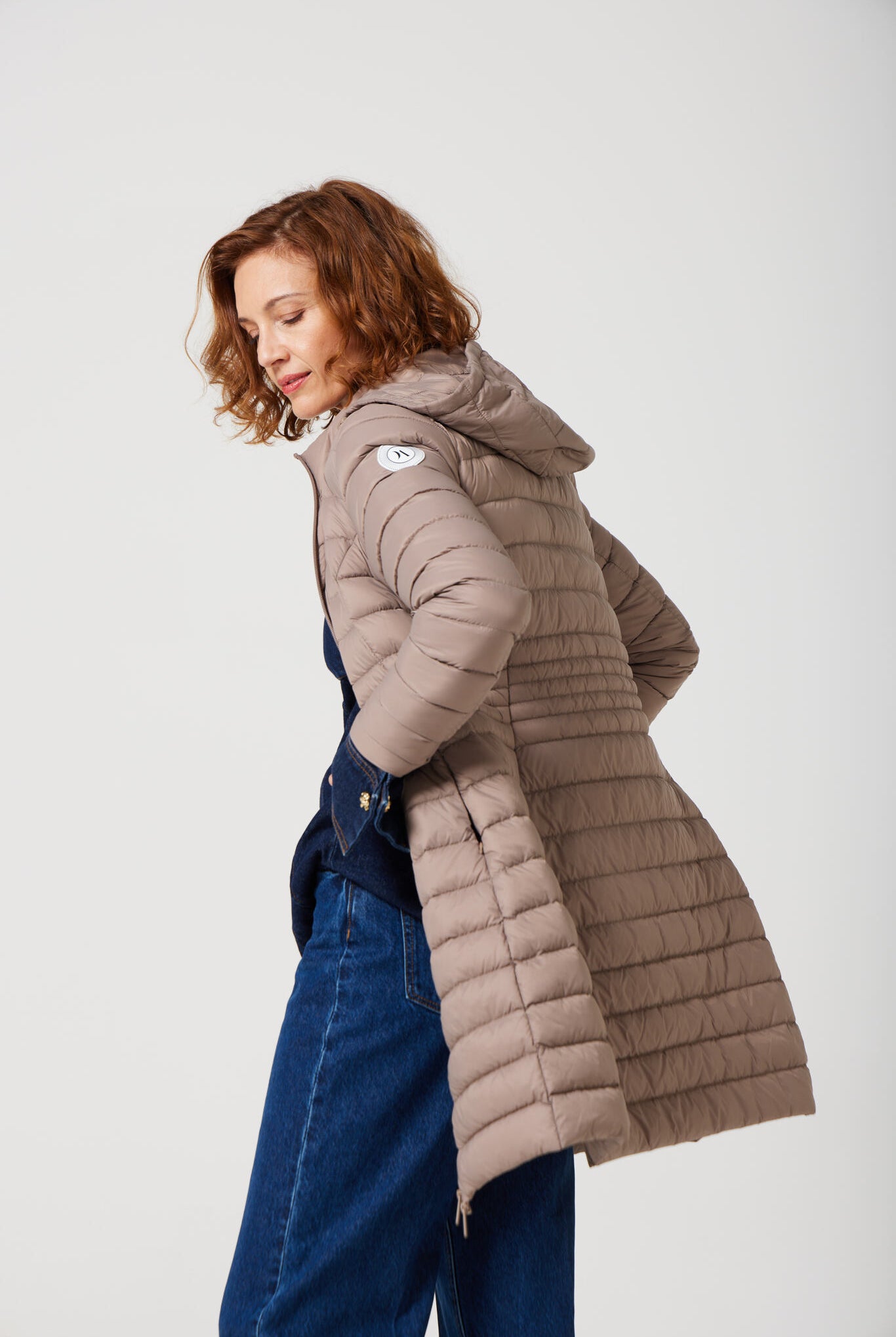 Women’s insulated midi-length hooded parka in chai beige, designed for warmth and comfort in South Africa’s winter season — Chai Midi Parka™