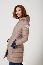 Women’s insulated midi-length hooded parka in chai beige, designed for warmth and comfort in South Africa’s winter season — Chai Midi Parka™