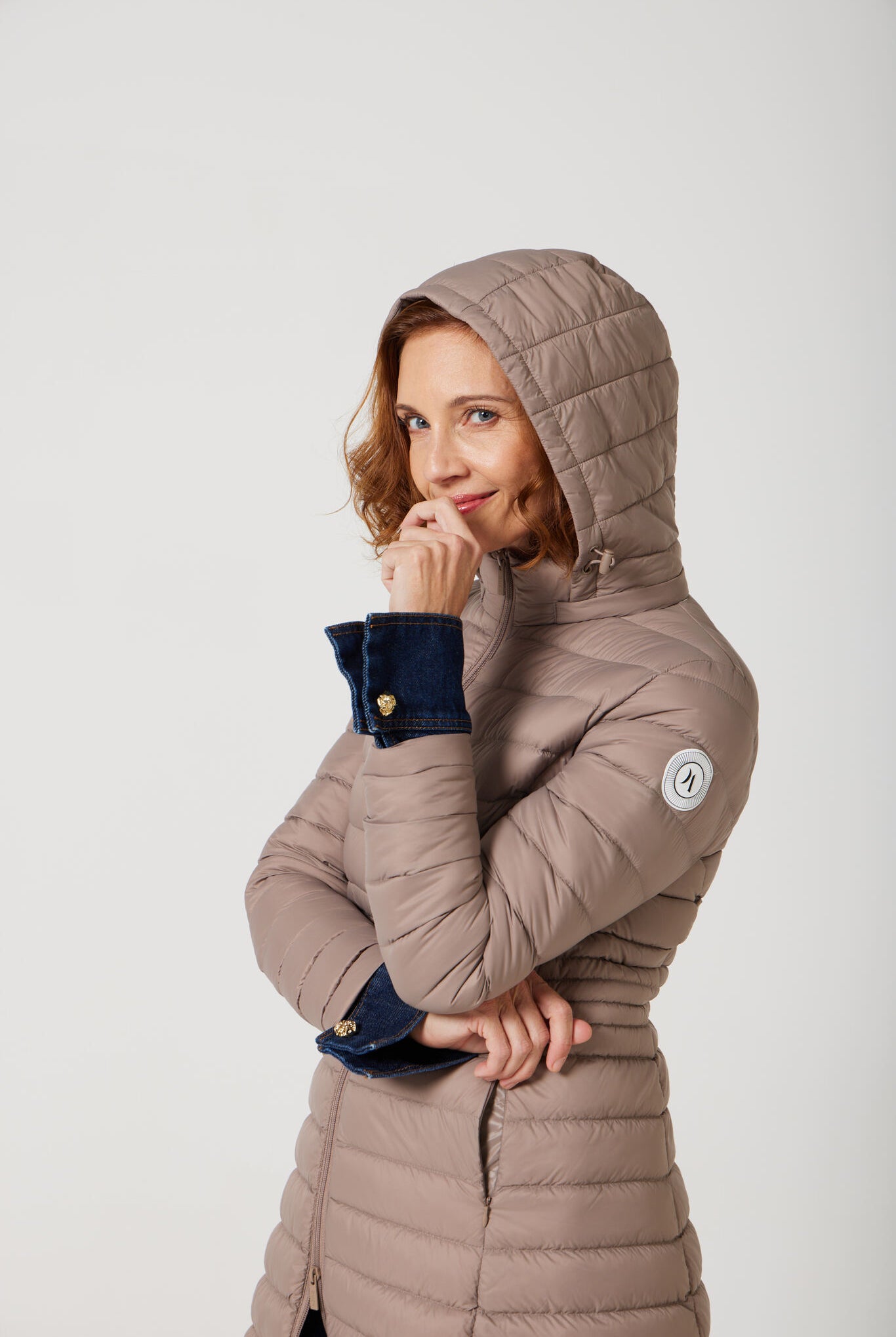 Women’s insulated midi-length hooded parka in chai beige, designed for warmth and comfort in South Africa’s winter season — Chai Midi Parka™