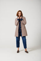 Women’s insulated midi-length hooded parka in chai beige, designed for warmth and comfort in South Africa’s winter season — Chai Midi Parka™