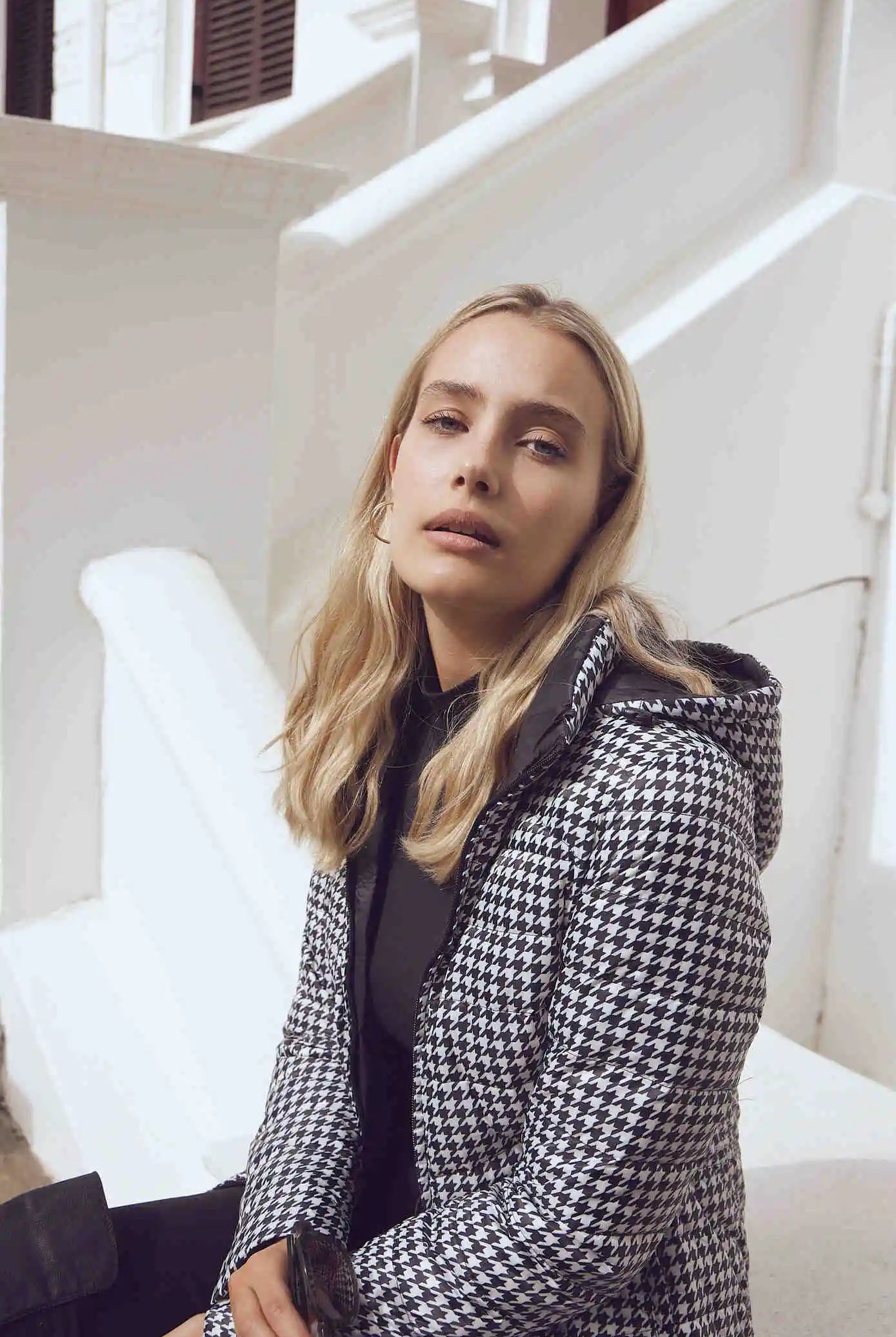 Women’s insulated reversible hooded parka in houndstooth print and midnight black, designed for warmth and comfort in South Africa’s winter season — Midnight x Houndstooth Classic Parka™