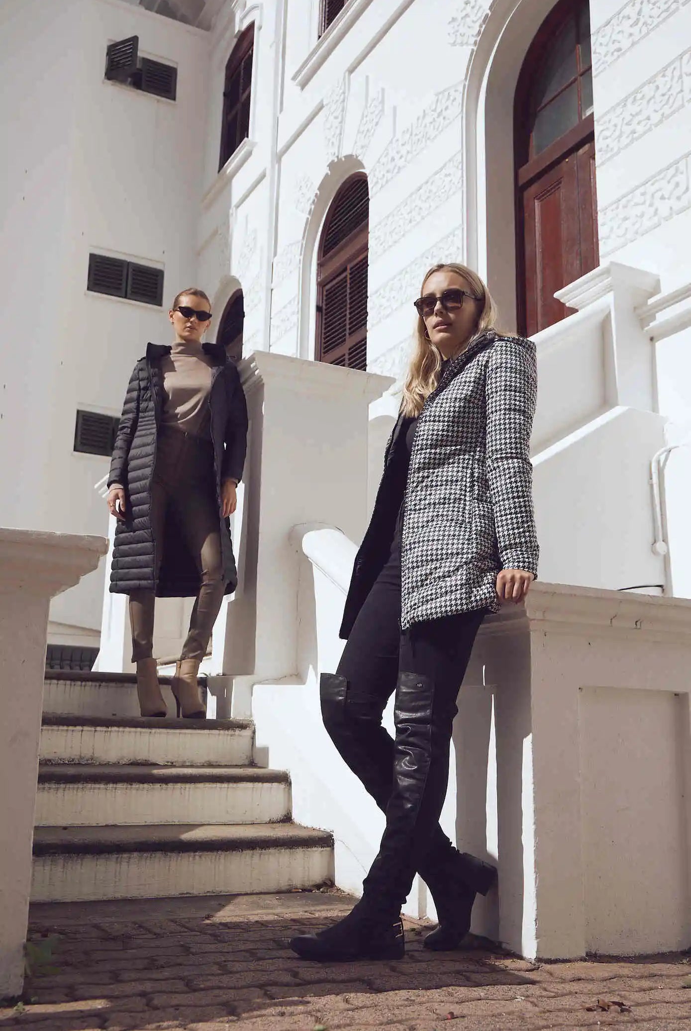 Women’s insulated reversible hooded parka in houndstooth print and midnight black, designed for warmth and comfort in South Africa’s winter season — Midnight x Houndstooth Classic Parka™