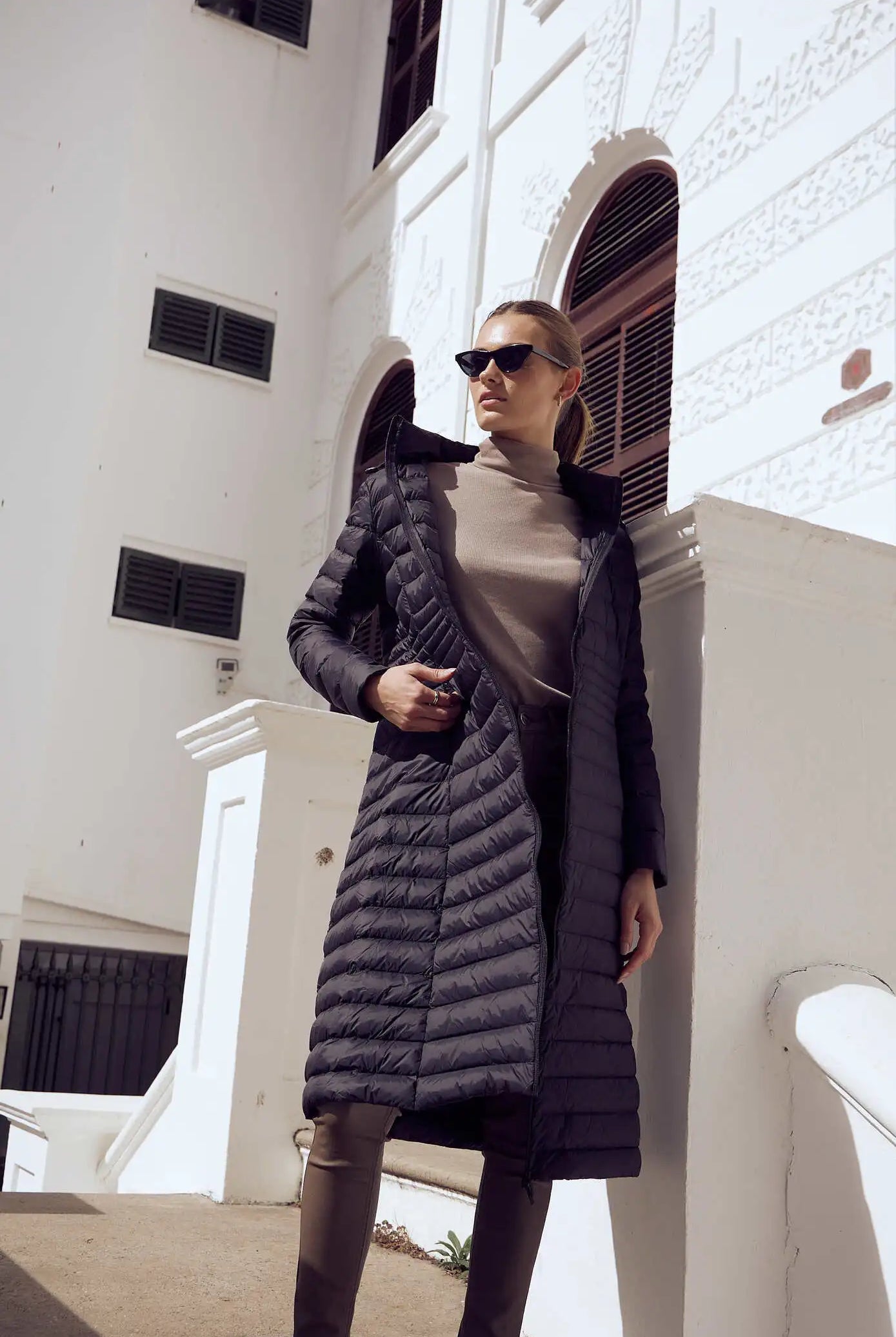 Women’s insulated ultra-length hooded parka in midnight black, designed for extra warmth and comfort in South Africa’s winter season — Midnight Ultra Parka™