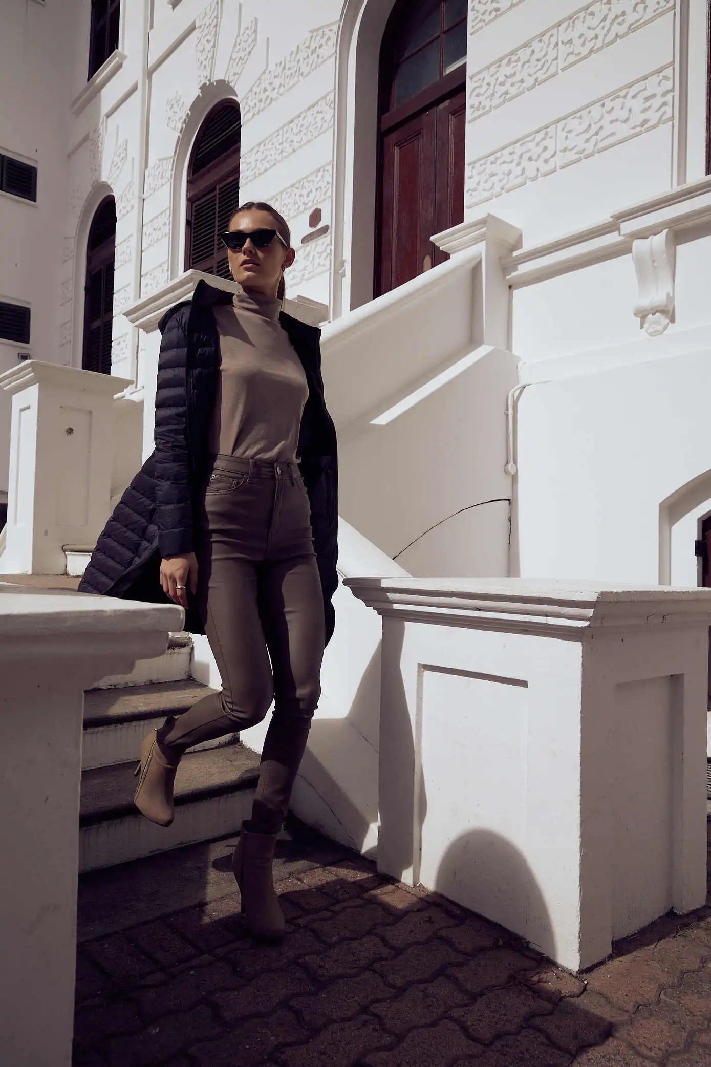 Women’s insulated ultra-length hooded parka in midnight black, designed for extra warmth and comfort in South Africa’s winter season — Midnight Ultra Parka™