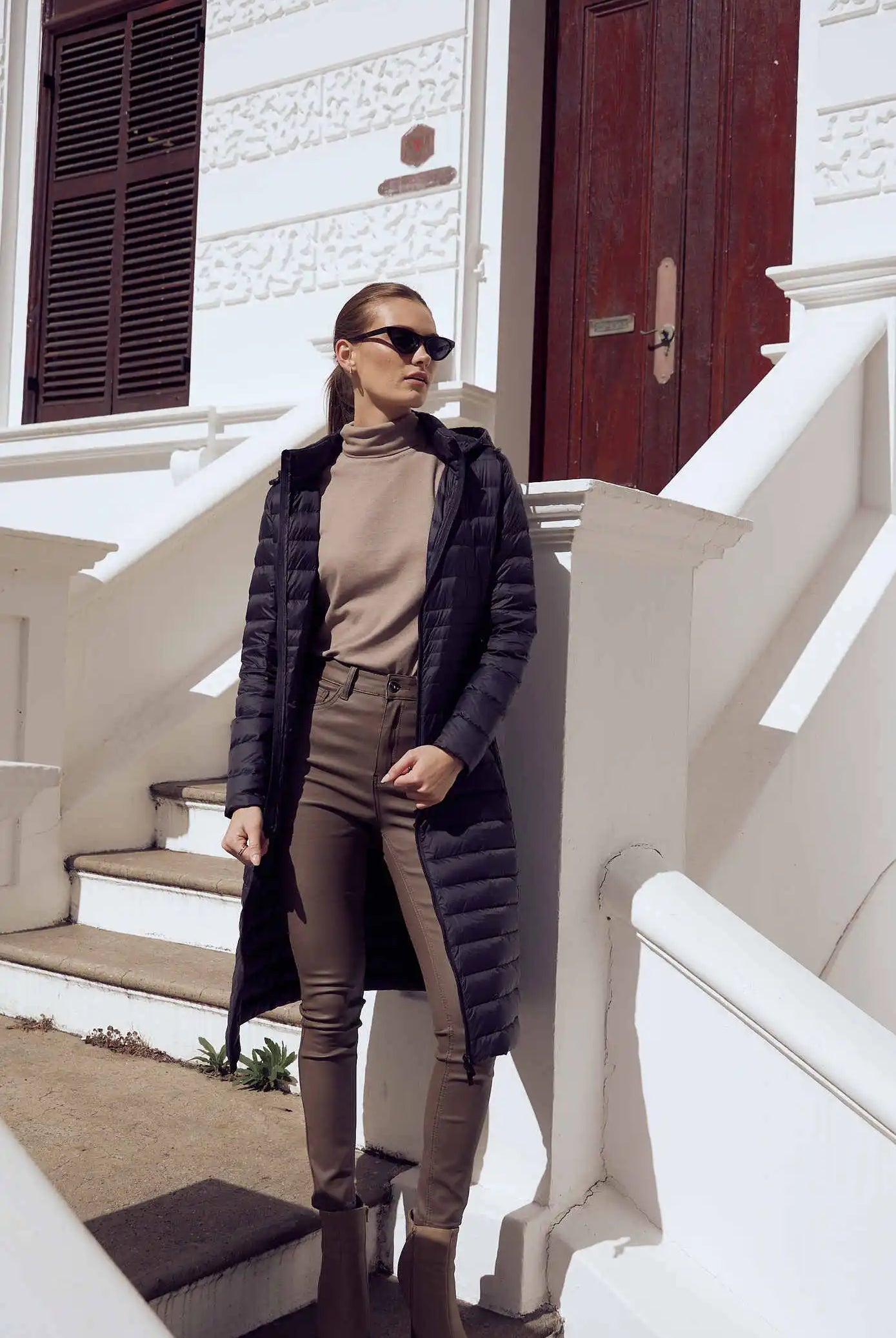 Women’s insulated ultra-length hooded parka in midnight black, designed for extra warmth and comfort in South Africa’s winter season — Midnight Ultra Parka™