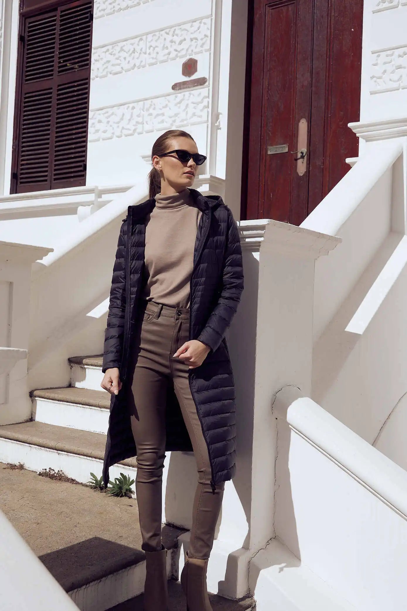 Women’s insulated ultra-length hooded parka in midnight black, designed for extra warmth and comfort in South Africa’s winter season — Midnight Ultra Parka™