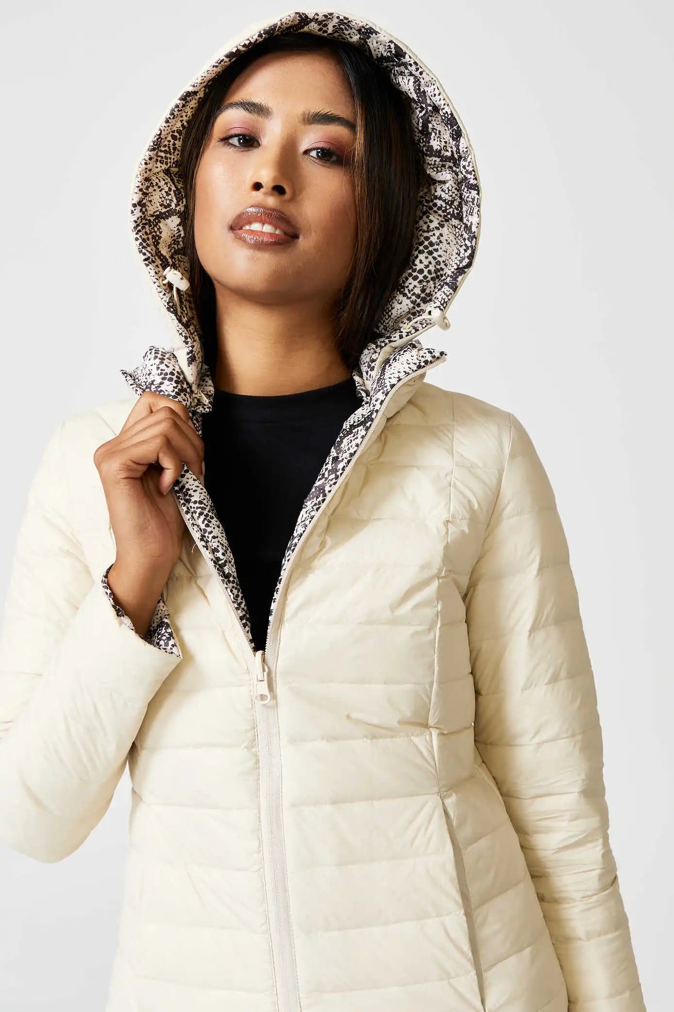 Women’s reversible cream puffer jacket with python-print inner lining and hood, lightweight insulated outerwear from Duck Apparel South Africa