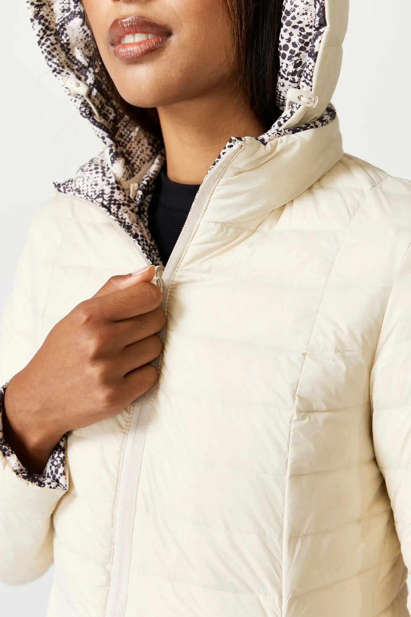 Women’s reversible cream puffer jacket with python-print inner lining and hood, lightweight insulated outerwear from Duck Apparel South Africa