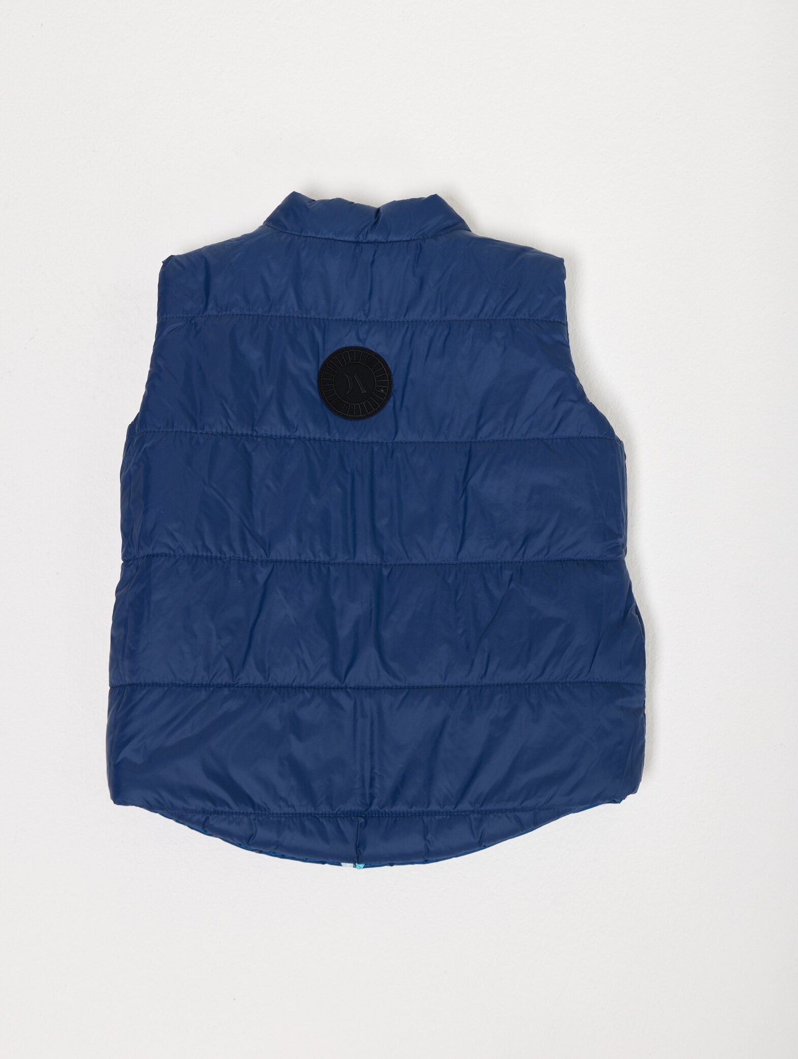 Kids Boats x Navy Gilet™ — sleeveless navy puffer vest with playful boat print, a versatile layer for kids in South Africa
