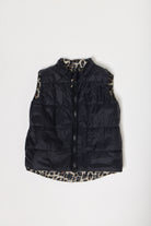 Kids Leopard x Black Gilet™ — sleeveless kids’ puffer vest in bold leopard print with black accents, a fun winter essential in South Africa