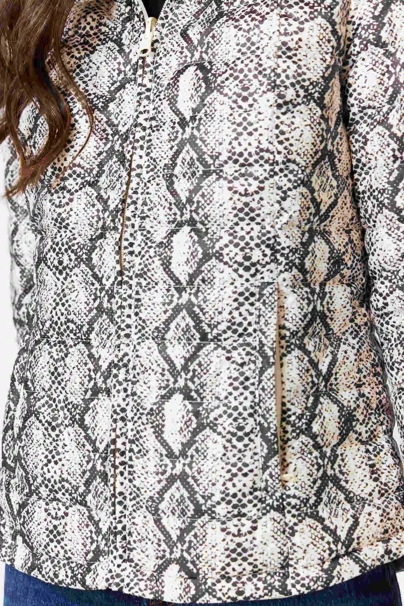 Women’s reversible cream puffer jacket with python-print inner lining and hood, lightweight insulated outerwear from Duck Apparel South Africa