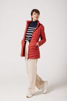 Women’s insulated hooded parka in rust red, designed for warmth and comfort in South Africa’s winter season — Rust Classic Parka™