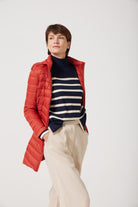 Women’s insulated hooded parka in rust red, designed for warmth and comfort in South Africa’s winter season — Rust Classic Parka™