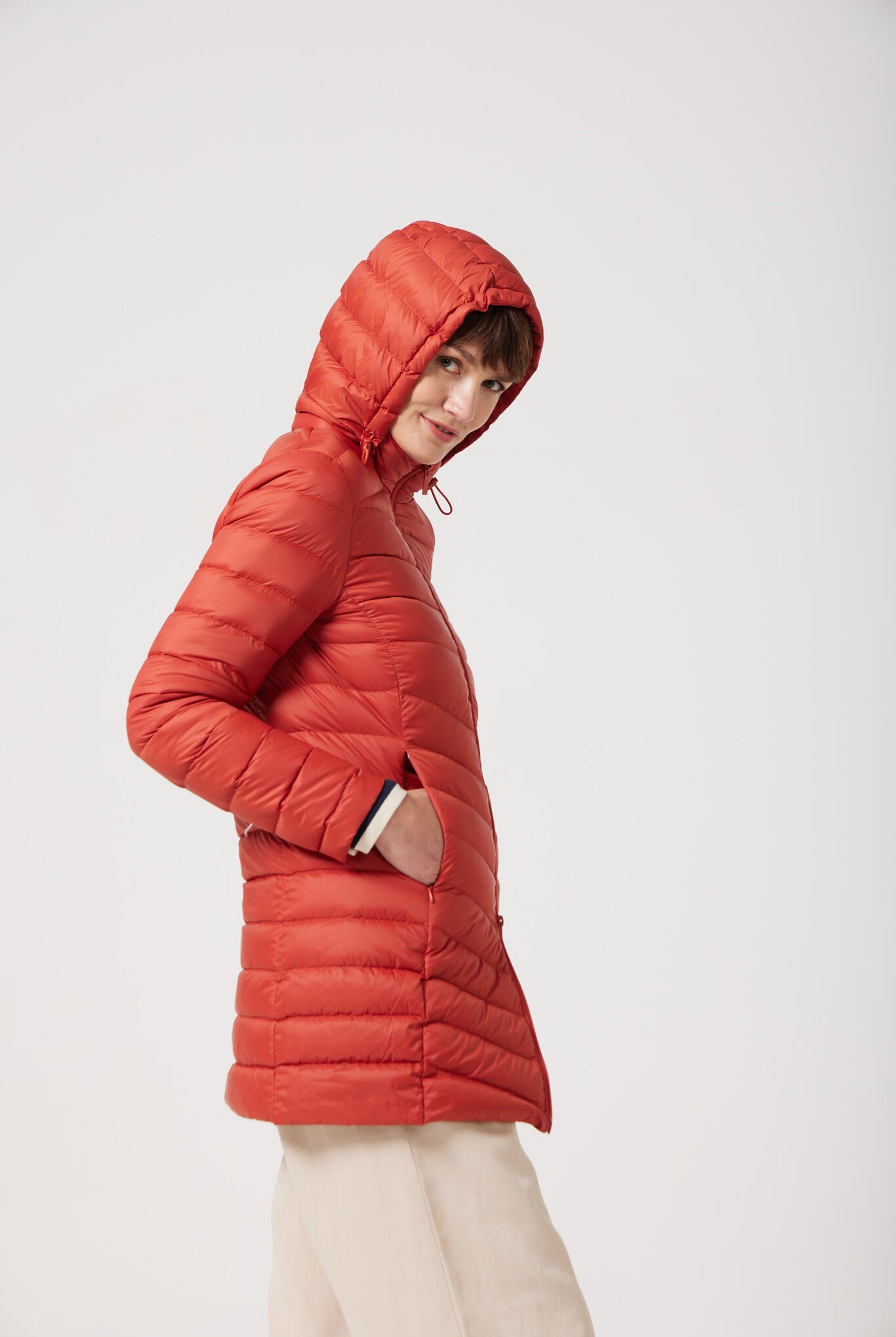 Women’s insulated hooded parka in rust red, designed for warmth and comfort in South Africa’s winter season — Rust Classic Parka™